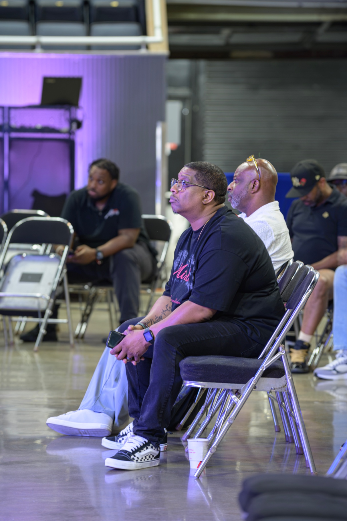 Men listening together during a Kingdom Builders Company gathering
