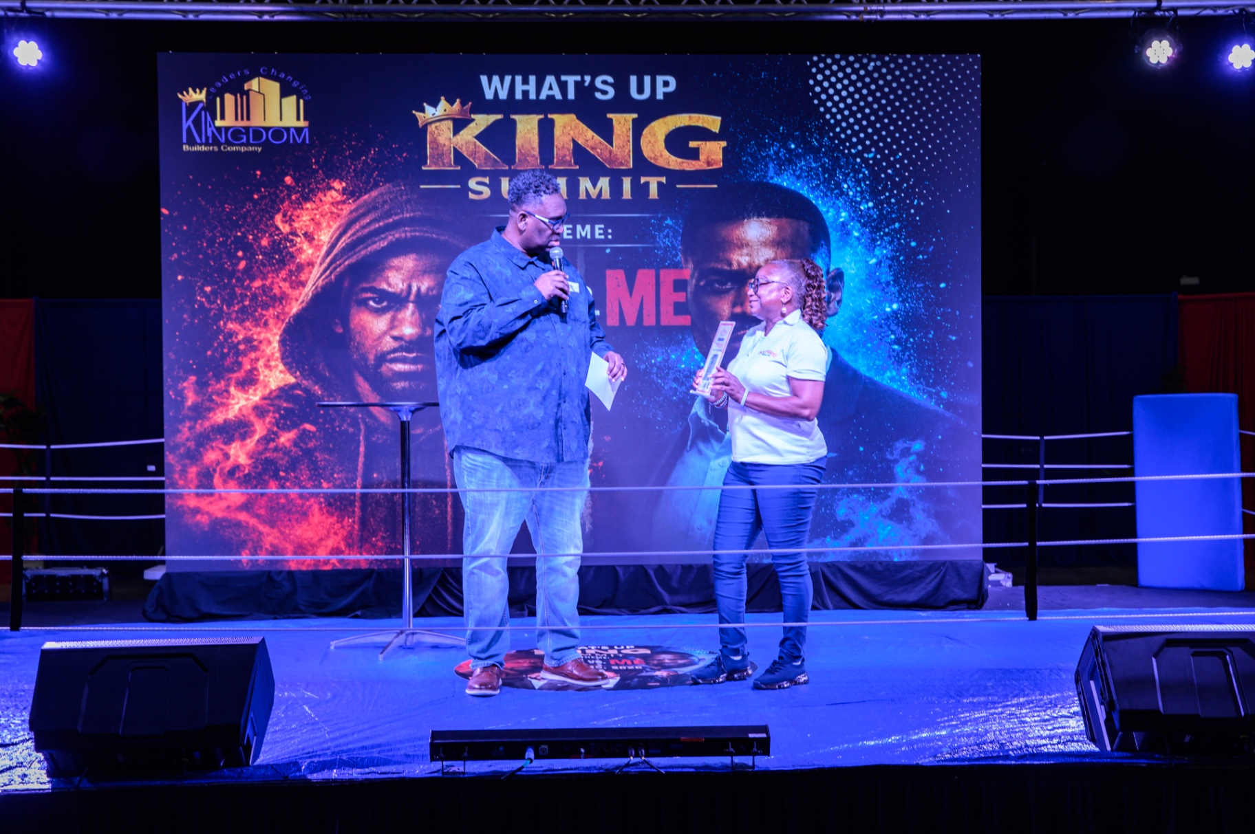 A featured speaker addressing the audience from the summit stage