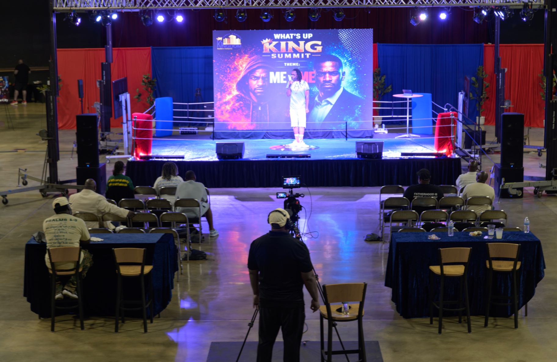 A wide view of the What's Up King stage, audience, and event production team