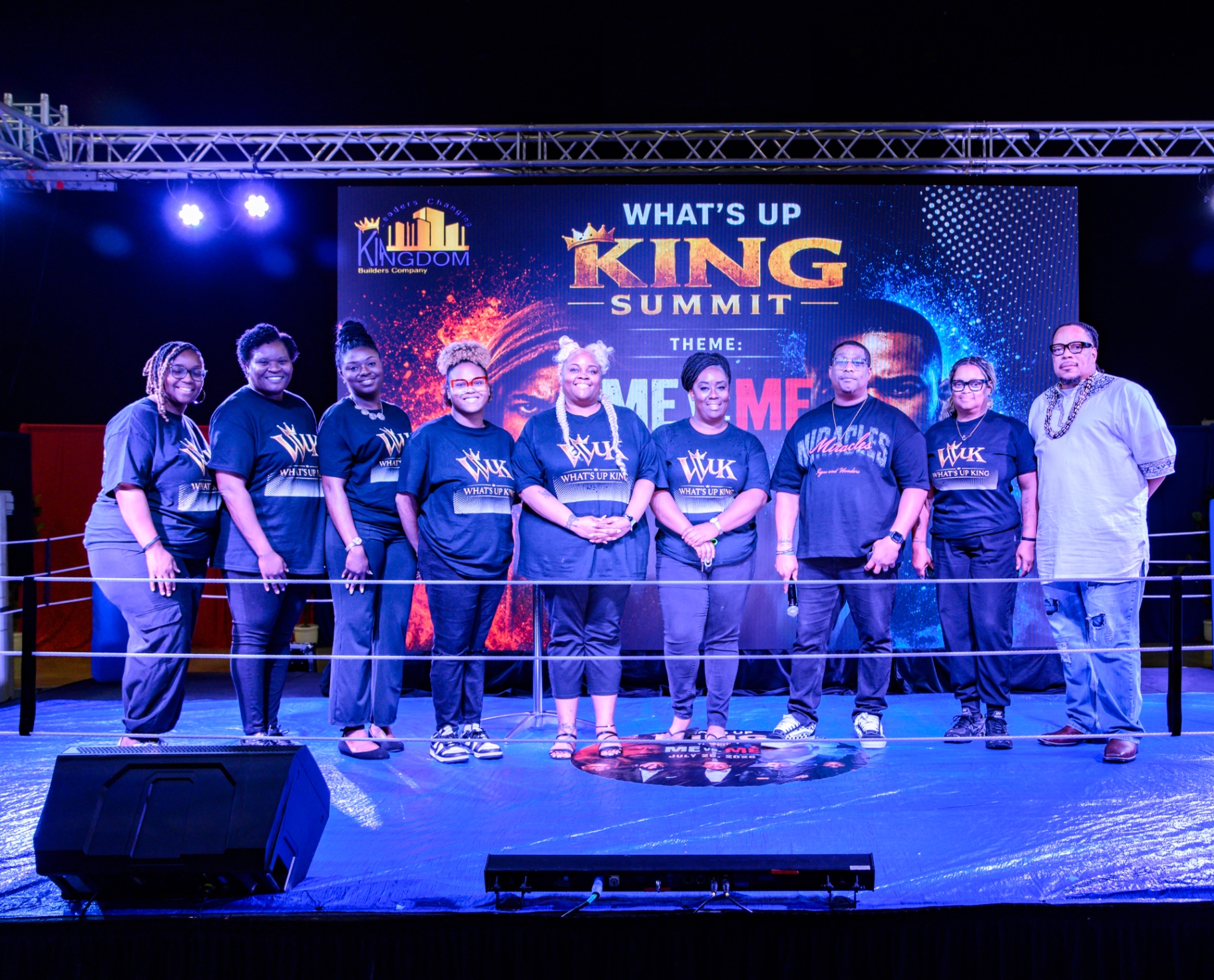 What's Up King summit participants gathered for a group photograph in event shirts